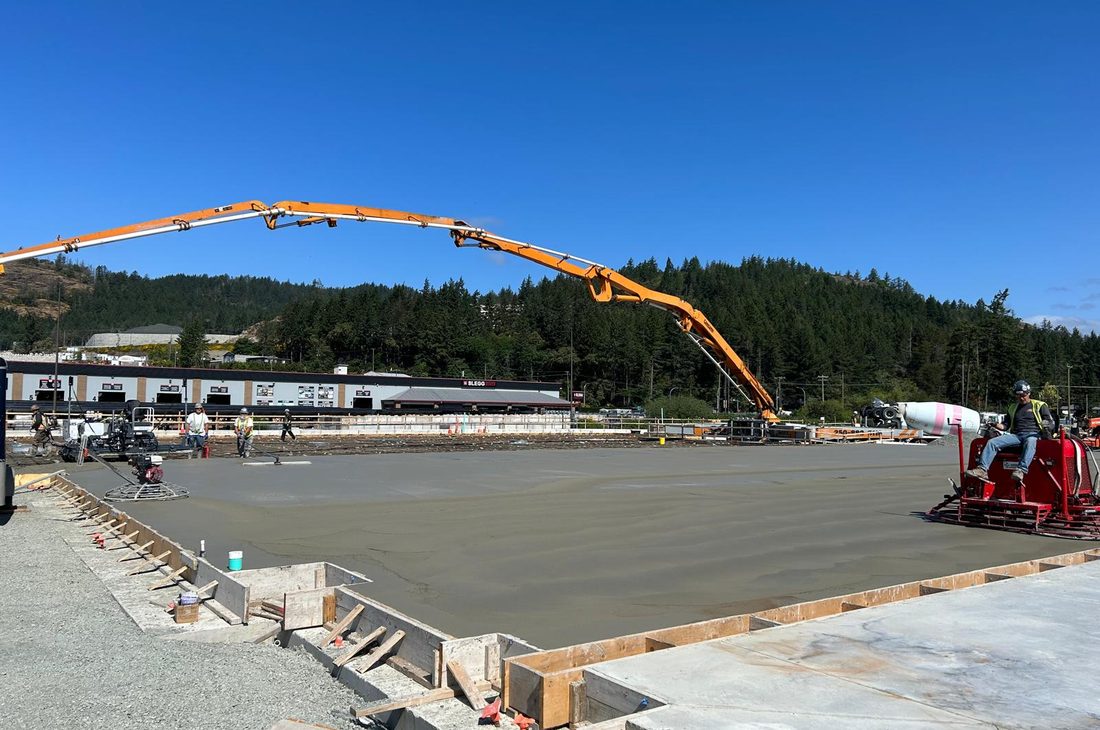 Concrete slab placement continuing into the evening