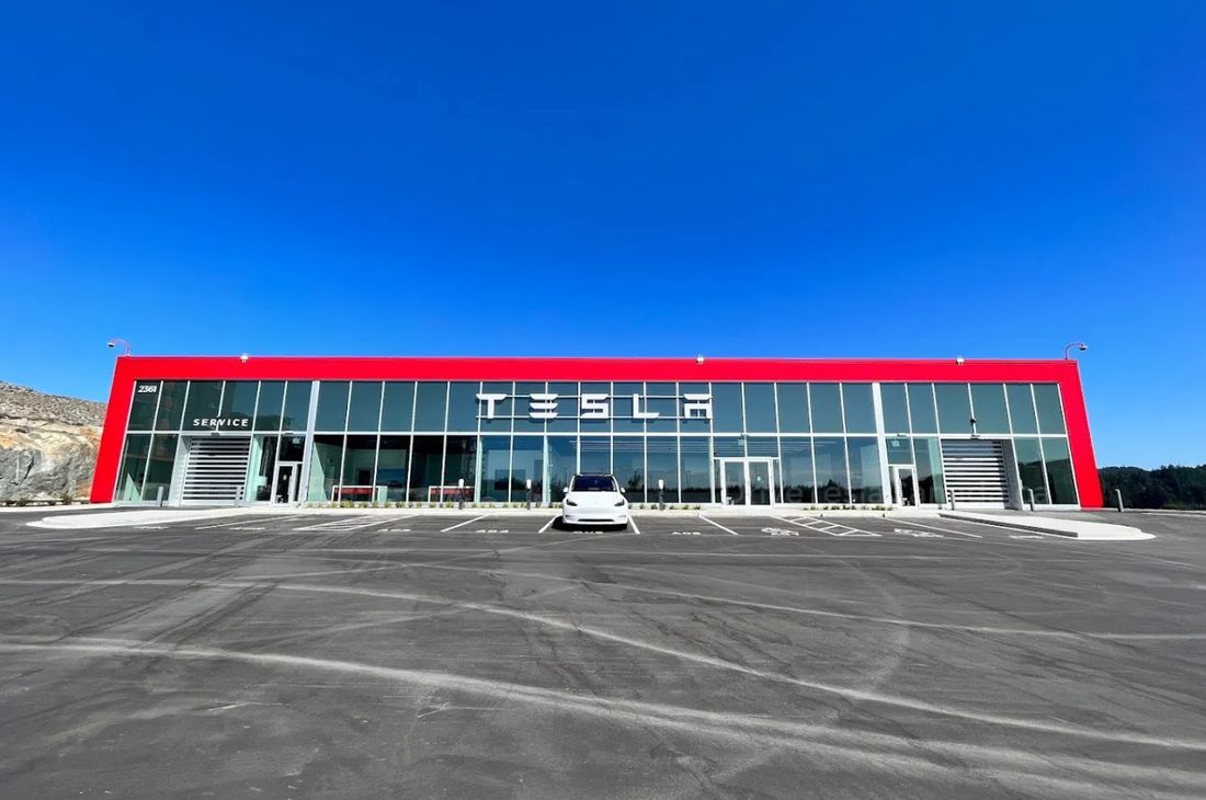Completed retail building with a large concrete apron